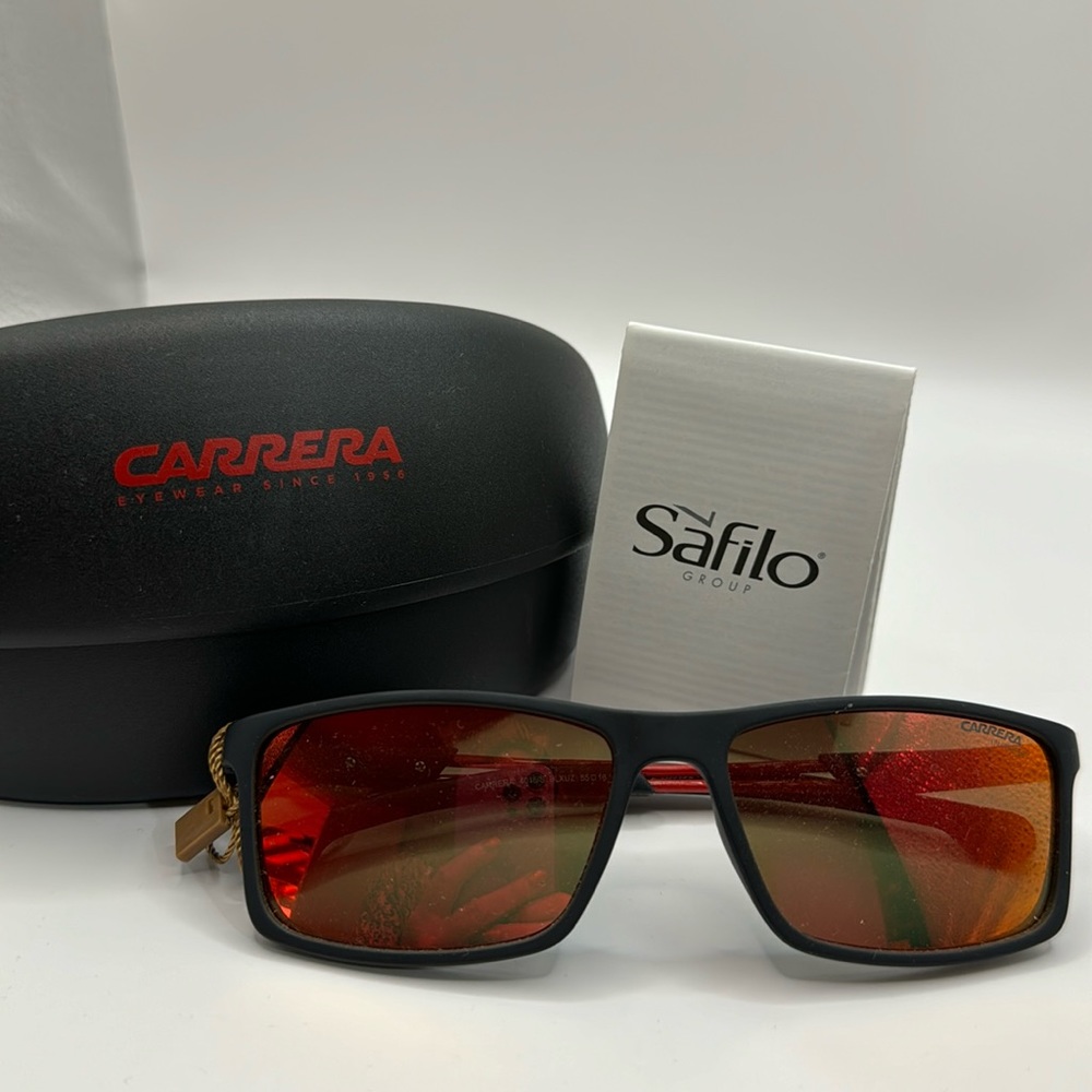 New in case Carrerasu glasses . Includes paperwork and case .